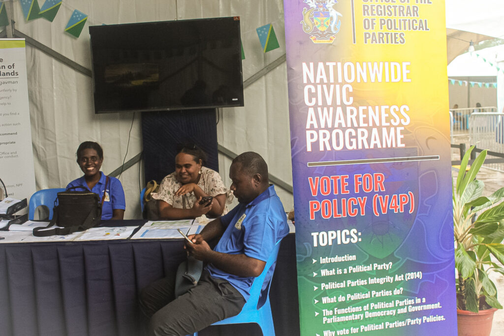 Office of the Registrar of Political Parties civic awareness information booth with public education banners.
