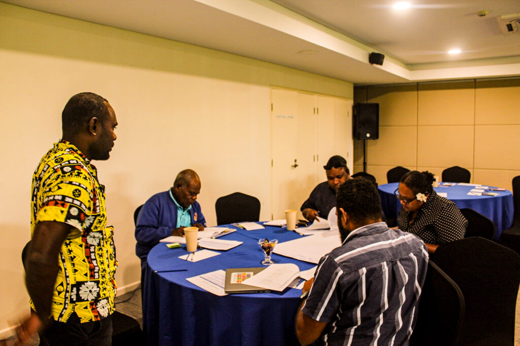 Facilitator guiding participants through a political party duties workshop.
